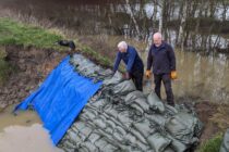 Volunteers are saving a golf course from 12 feet of flooding